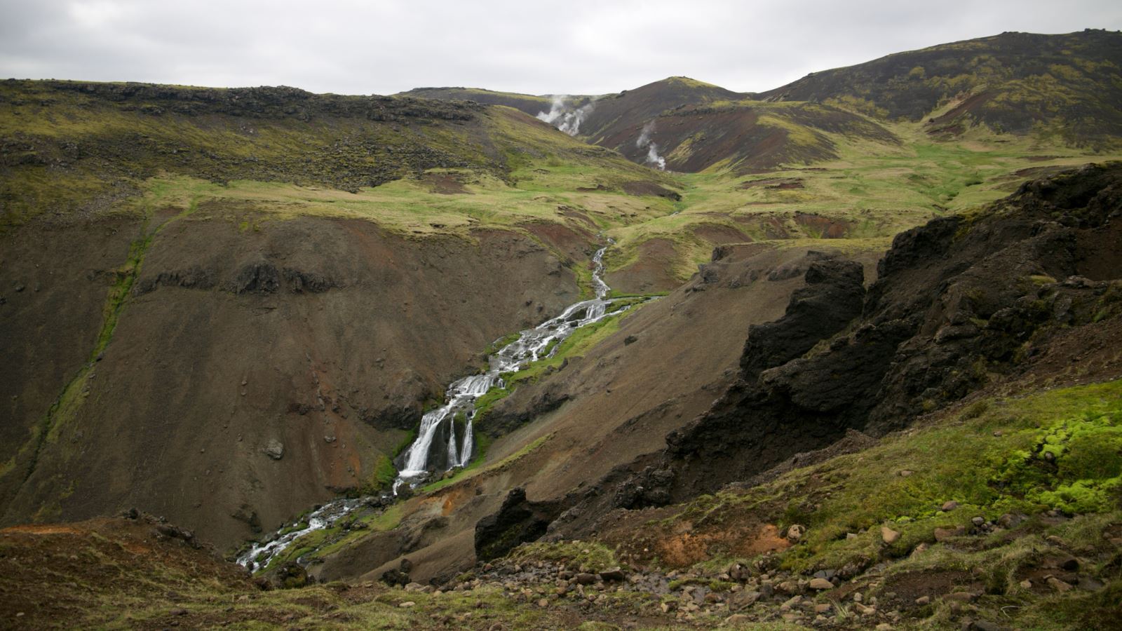 Water trickling through the hills from the steaming Reykjadalur Valley