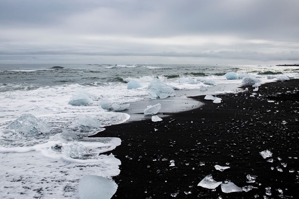 Ice on the shore of Diamond Beach, Iceland on a cloudy day