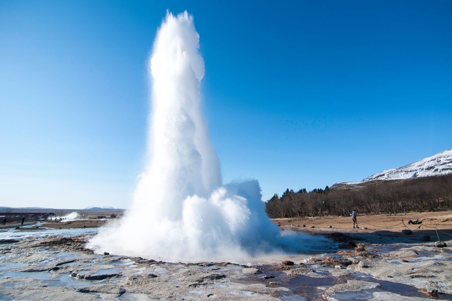 The famous Geysir against a blue sky in Iceland