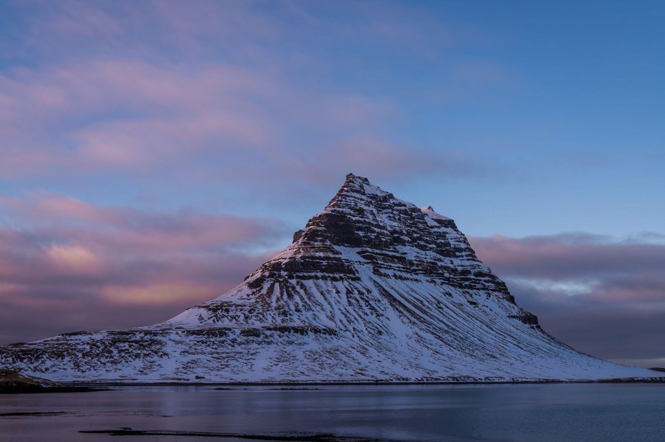 Snow-covered Kirkjufell Mountain at sunset