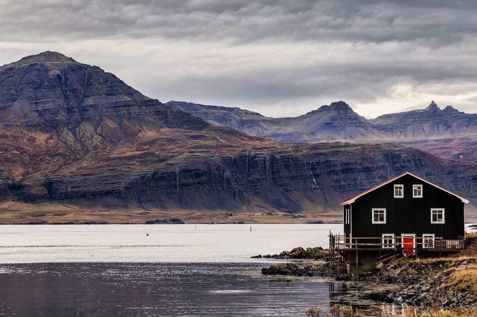 House overlooking a body of water in the Eastfjords of Iceland