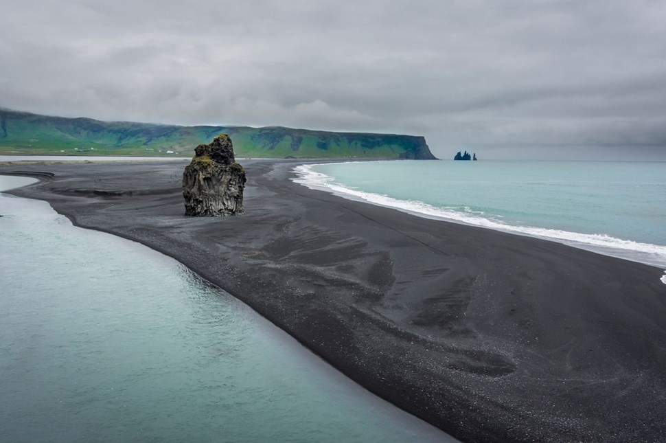 Reynisfjara black sand beach in South Iceland on a cloudy day