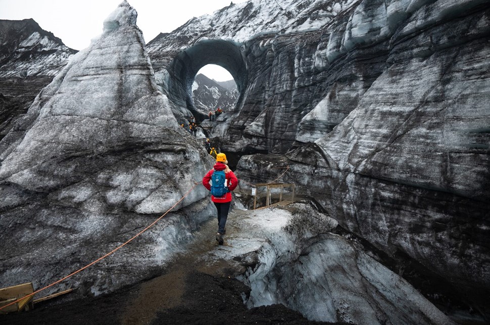 Woman exploring Katla ice cave