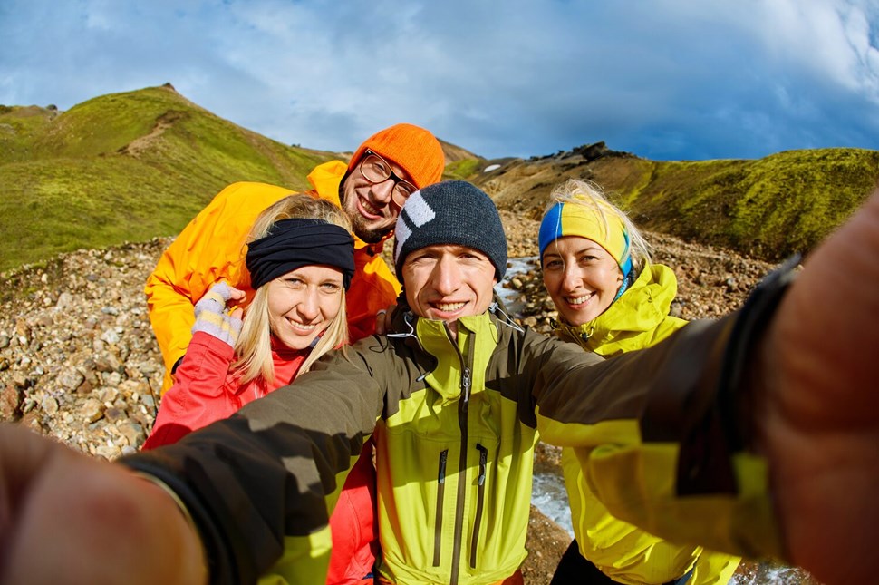 Happy tourists group selfie