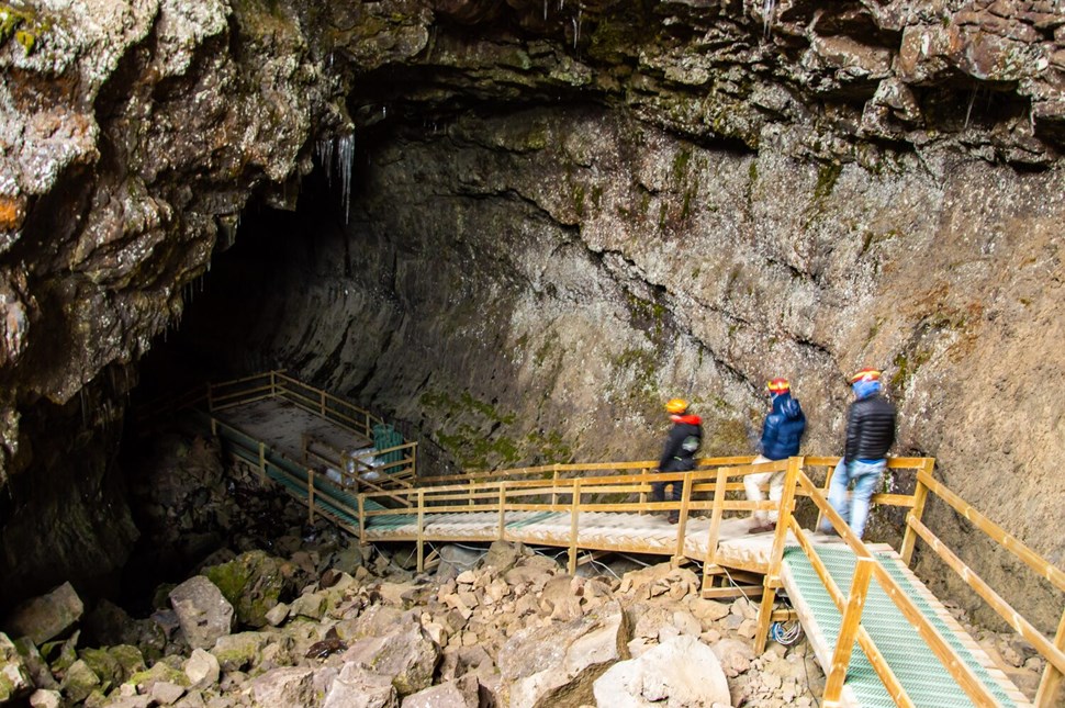 People entering Vidgelmir Cave