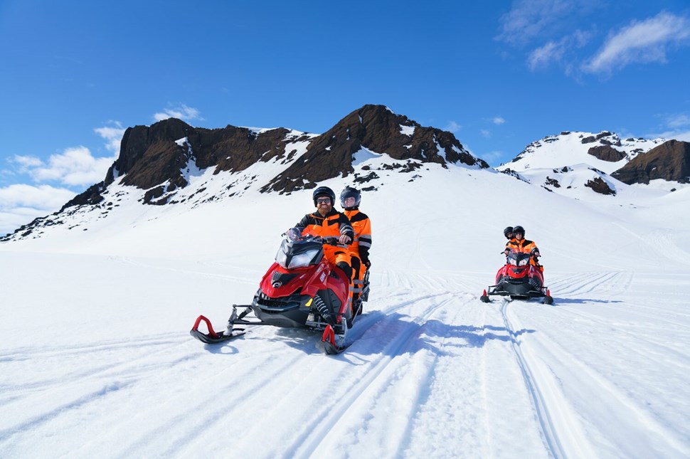 Two snowmobiles driving on Langjokull glacier