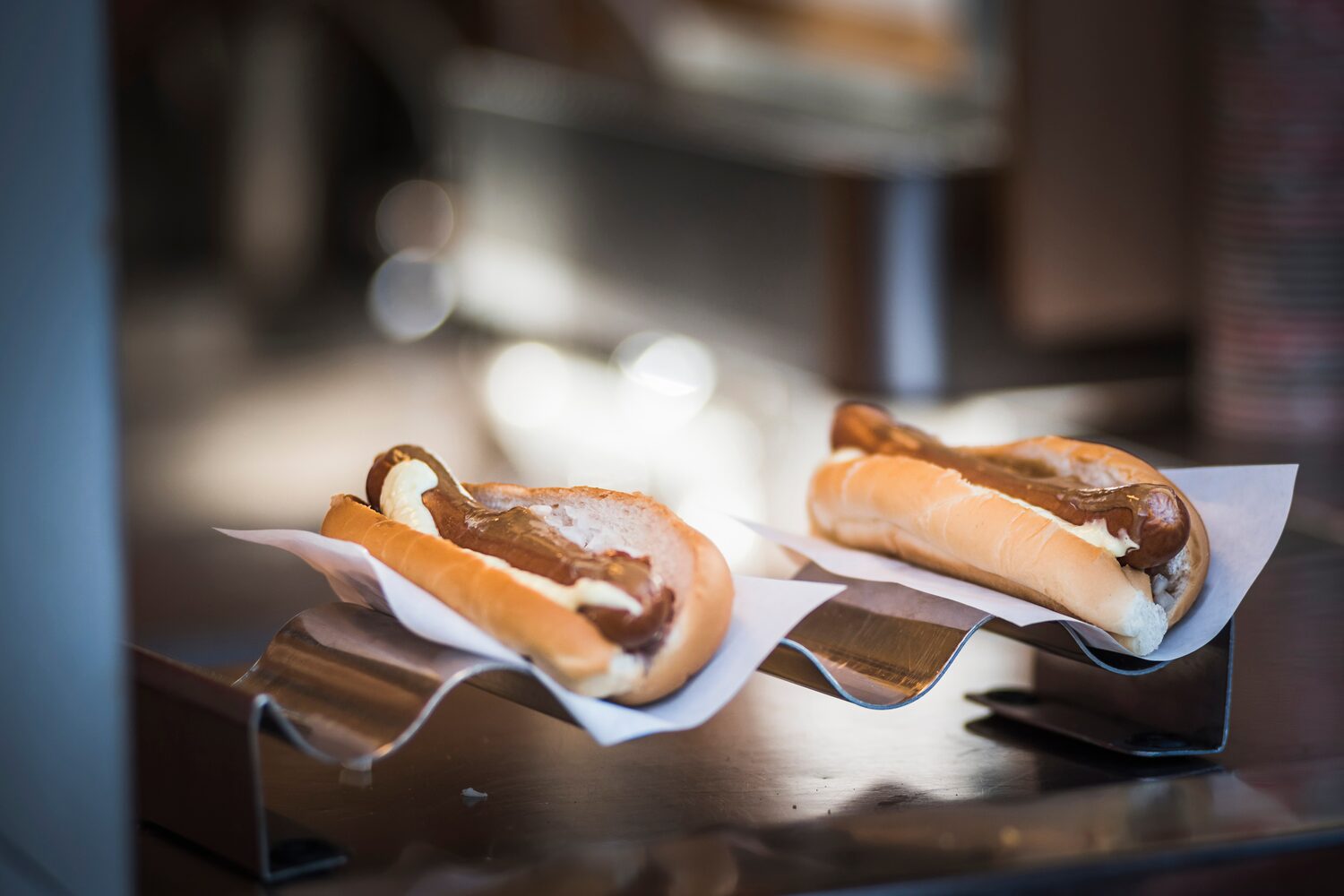 Two hot dogs on display