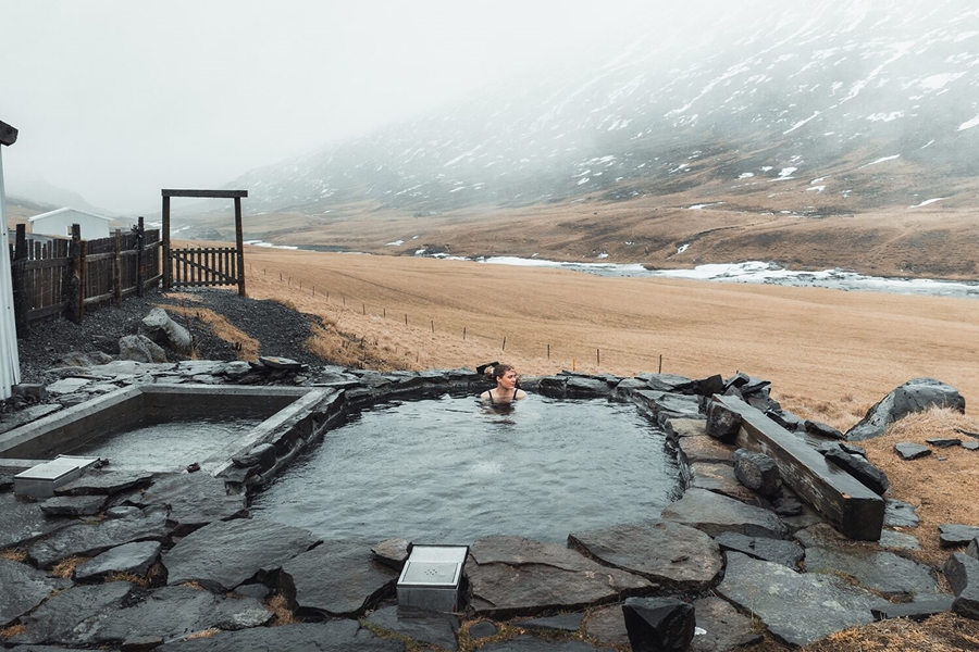 Woman bathing in hot spring pool
