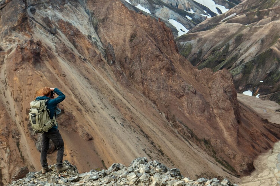 Man photographing mountain in Iceland
