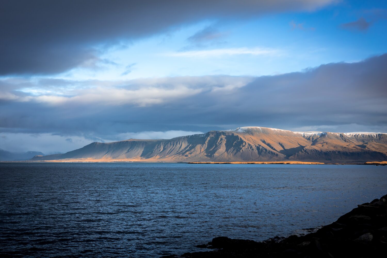 Mount Esja at distance in dramatic weather 