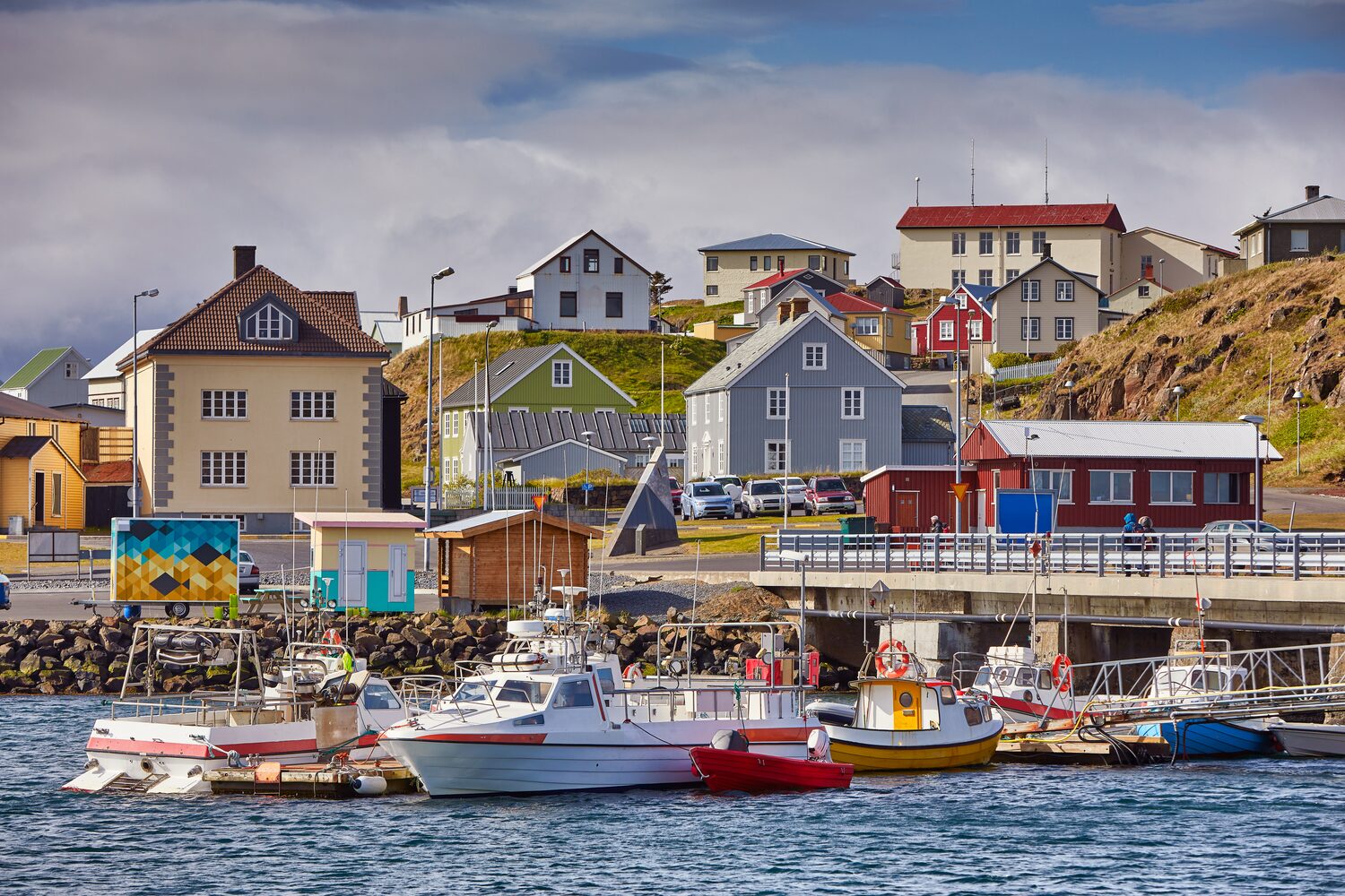 Colorful harbor view of boats and houses