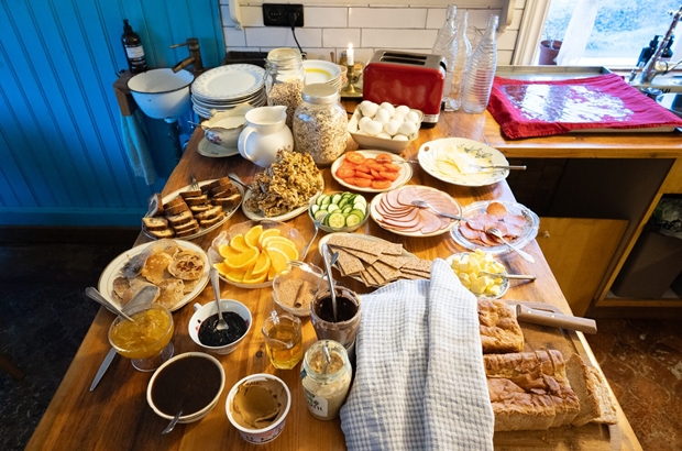 Full breakfast table at farm hotel in Iceland
