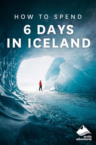 Man inside ethereal glacial tunnel