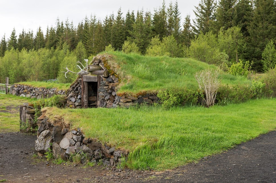 stone hut with grass roof reykholt iceland