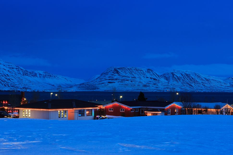 Typical Icelandic houses with Christmas decorations near Akureyri, Iceland.