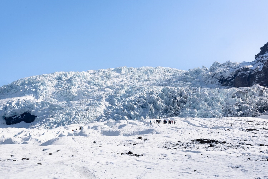 People walking on giant glacier in Iceland