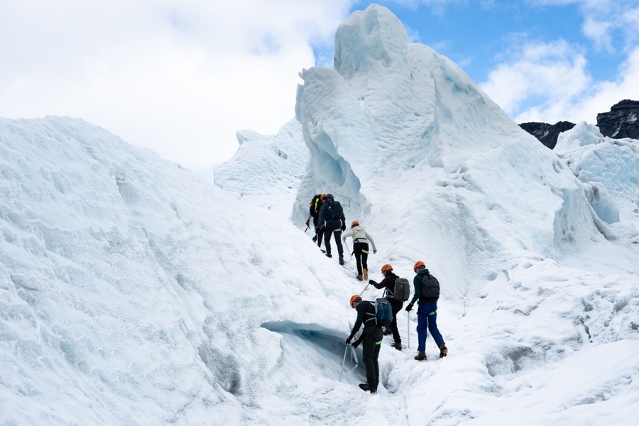 Group walking on glacier in Iceland