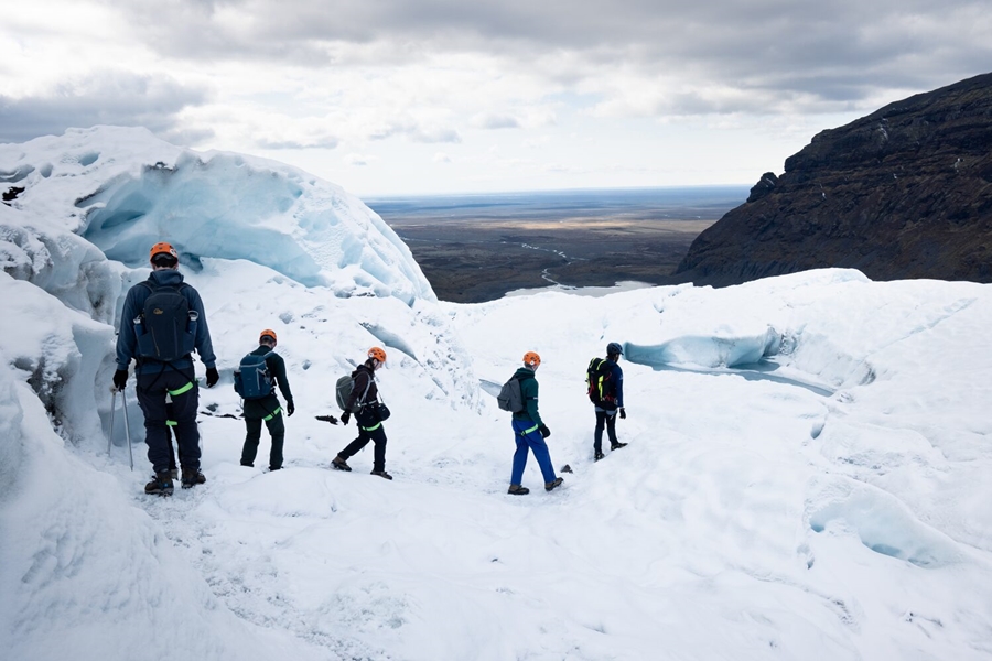 People walking on the glacier top