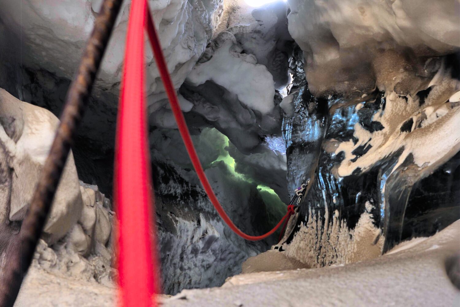 Red robe in glacier ice cave