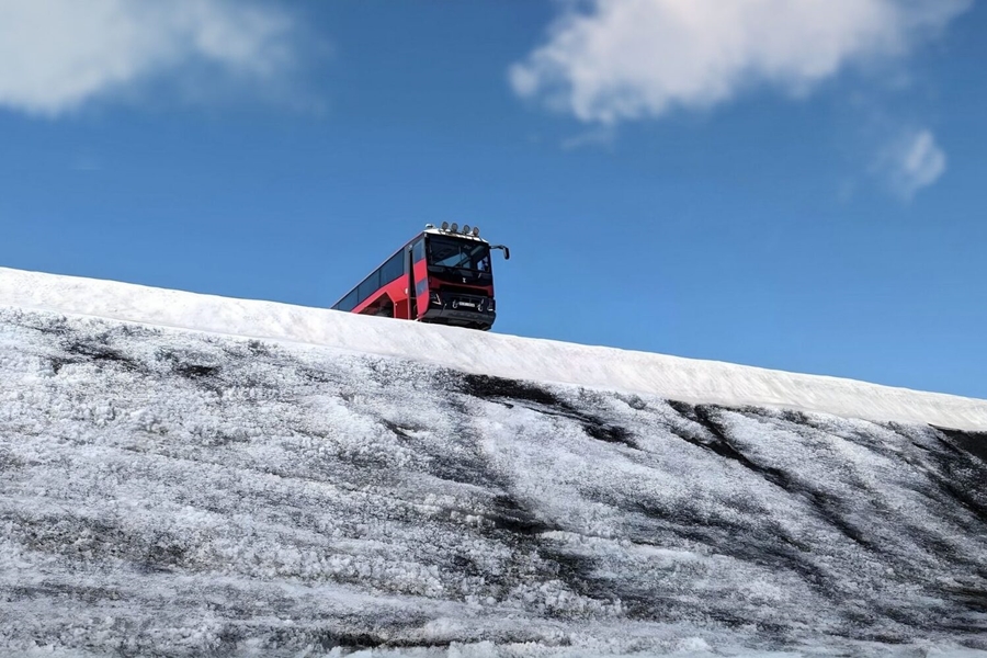 Red truck on glacier