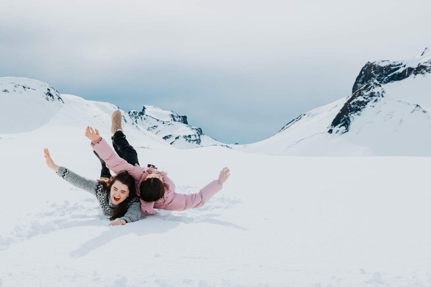Women rolling on snow