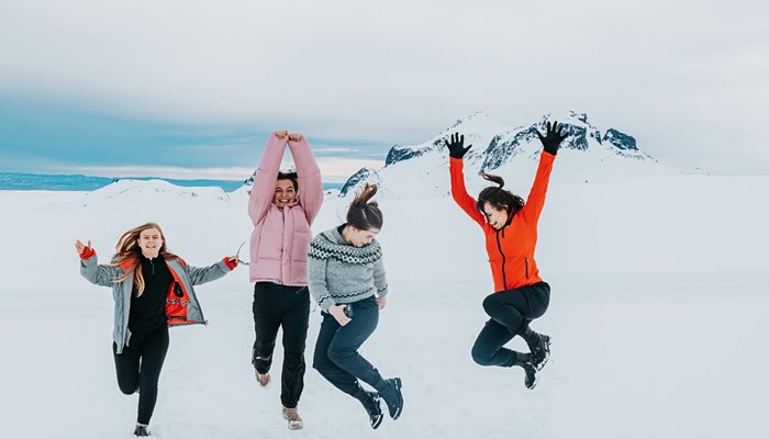 Woman having fun on glacier in Iceland