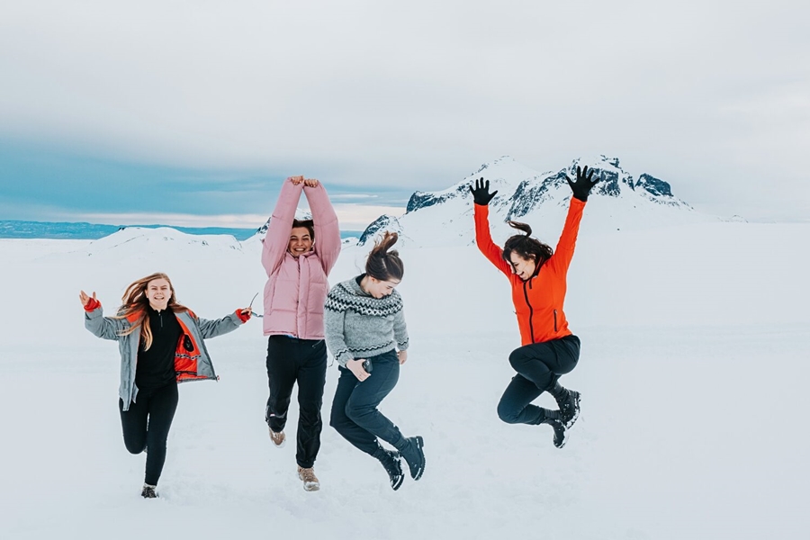 Woman having fun on glacier in Iceland