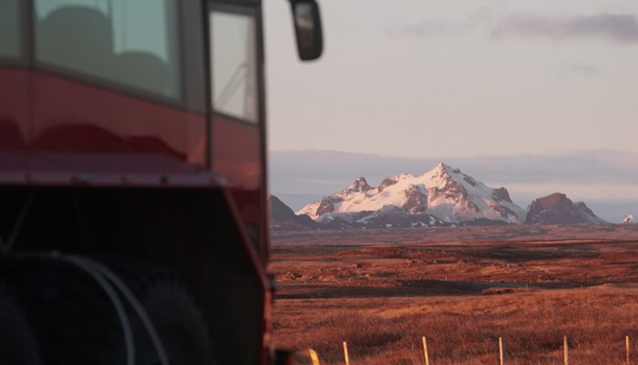Truck driving at sunrise in Iceland