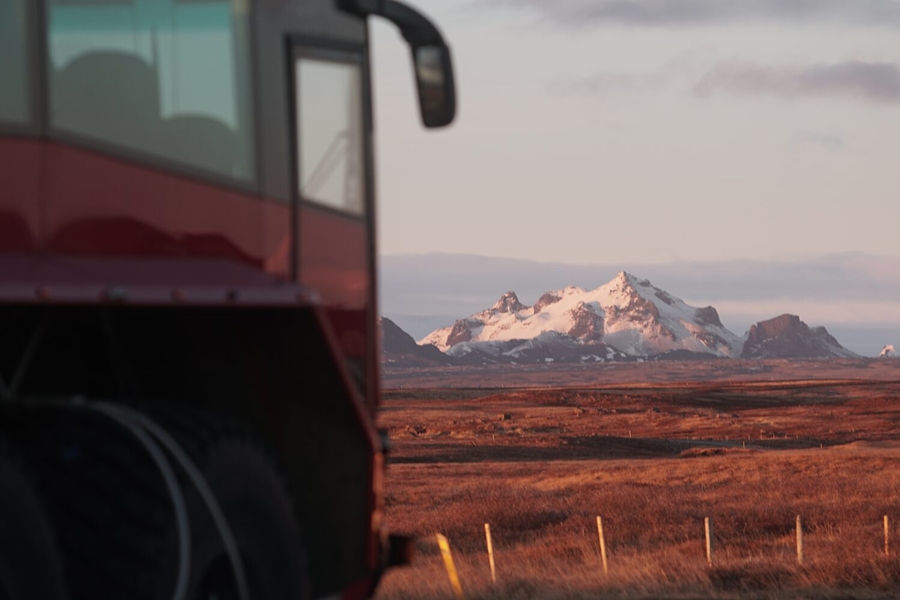 Truck driving at sunrise in Iceland