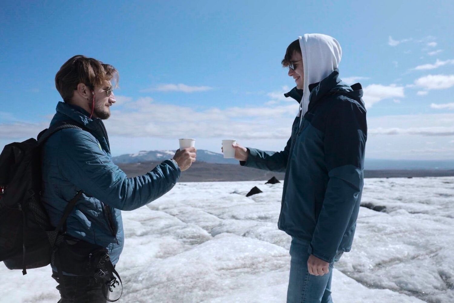 Men having coffee on glacier