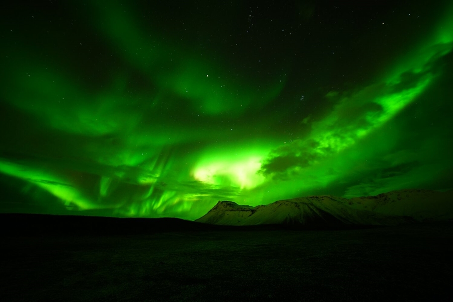 Green Aurora above the mountain in Iceland