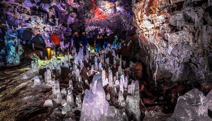 Colorful lava tunnel full of stalagmites