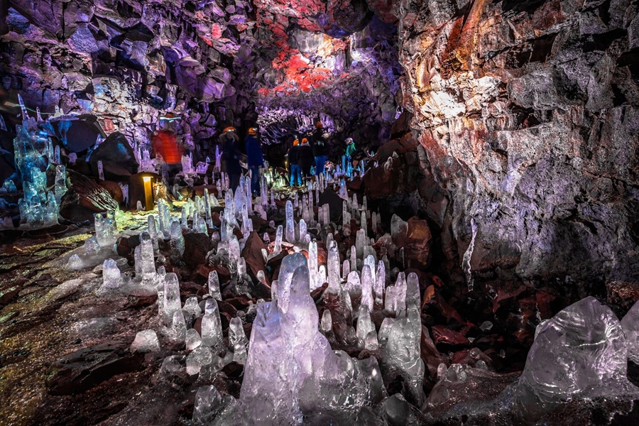 Colorful lava tunnel full of stalagmites