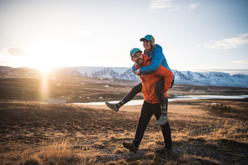 Happy couple having fun in Icelandic fields