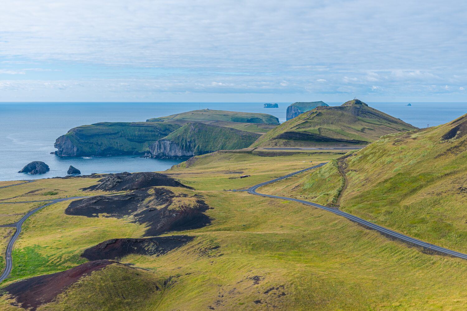 Aerial view of Storhofdi peninsula of Heimaey island in Iceland