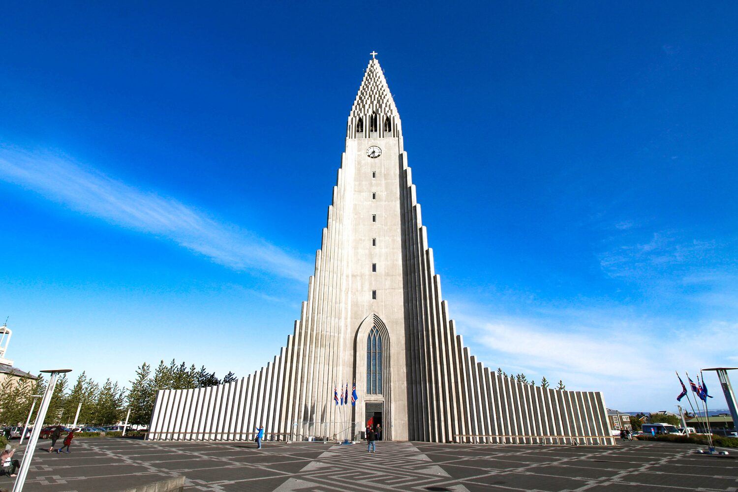 Reykjavik church in Iceland in front view, with bright blue sky in background.