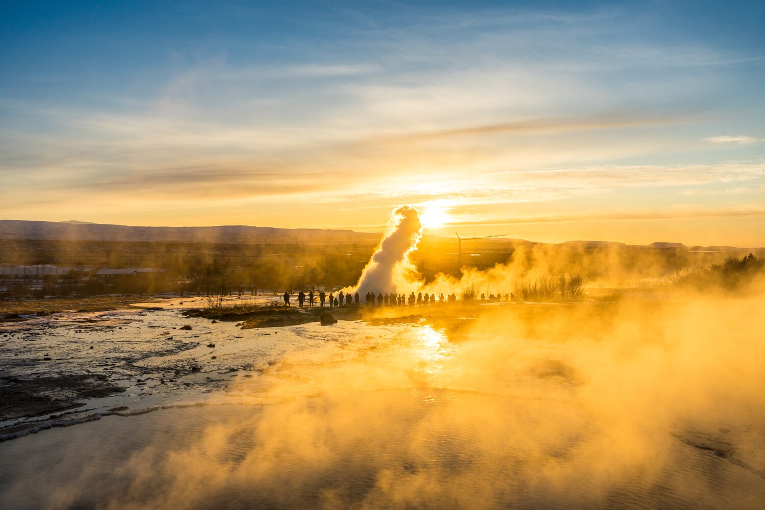 Geysir hotspring in Iceland during golden sunset.