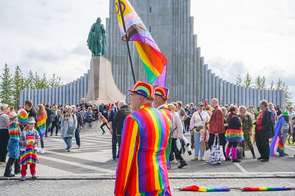 Crowds dressed in multicolors at Reykjavik pride celebration in Iceland.