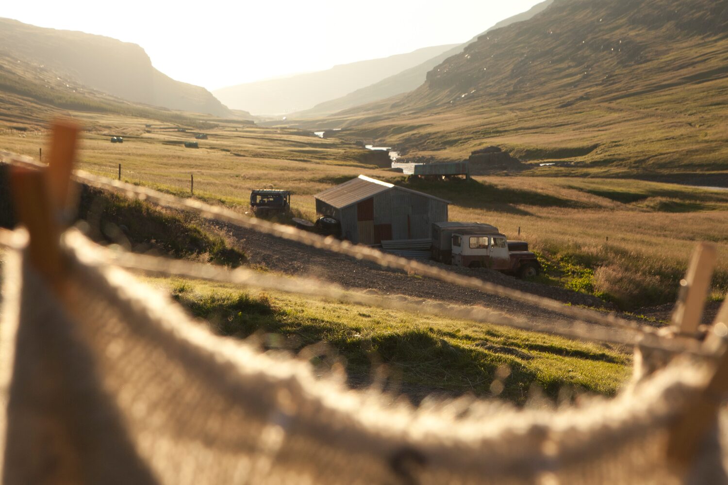 View of sun setting in background of Wilderness center hotel in Iceland.