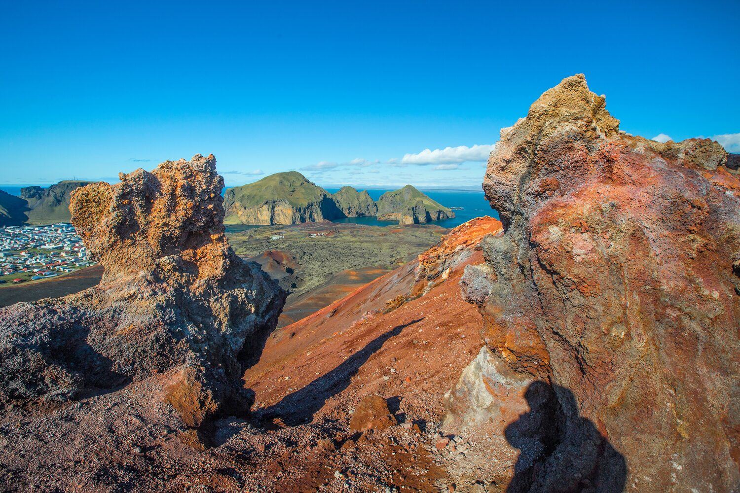 Volcanic landscape and islands in the sea from  viewpoint of summit of the volcano Eldfell volcano.