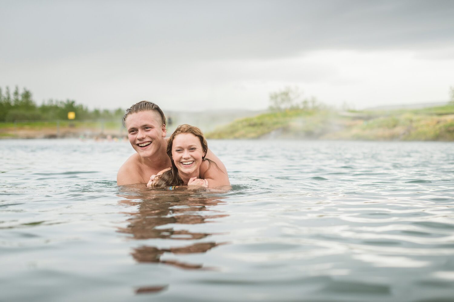 Couple of people bathing in Lagoon hot spring waters