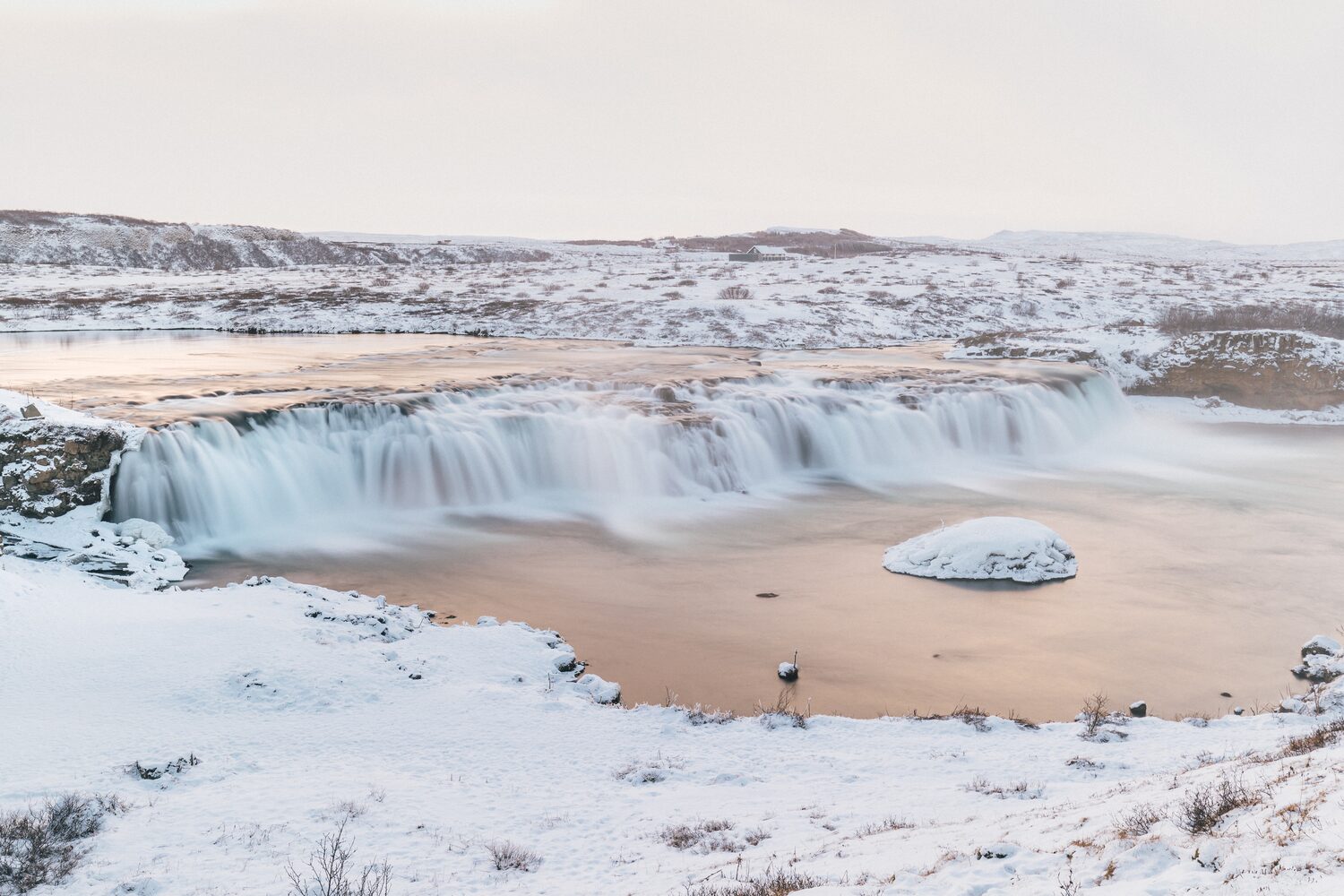Faxi waterfall surrounded by snow