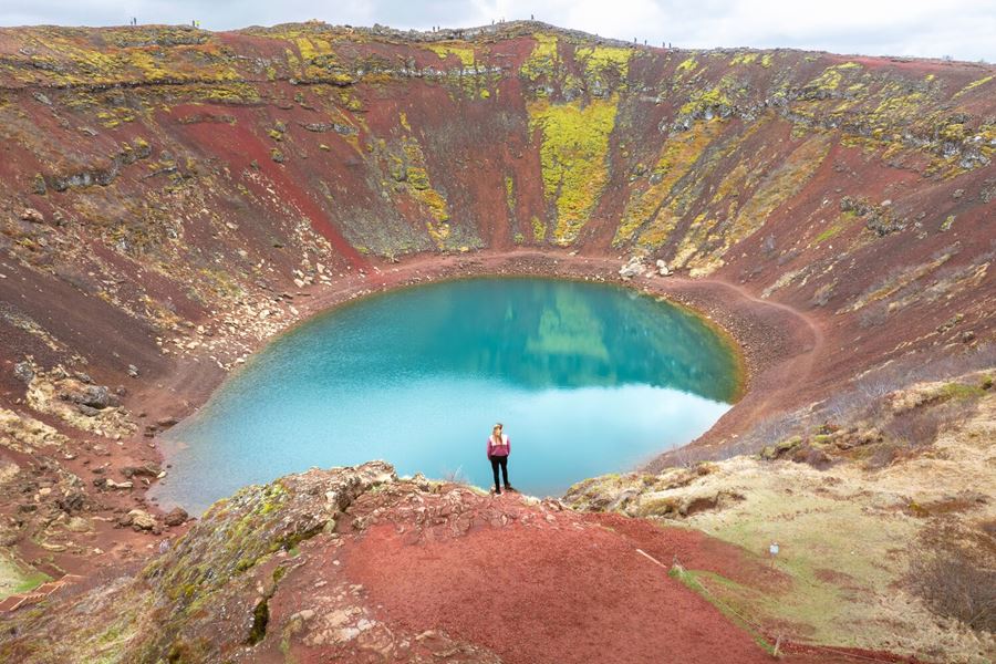 Woman by volcanic crater in Iceland