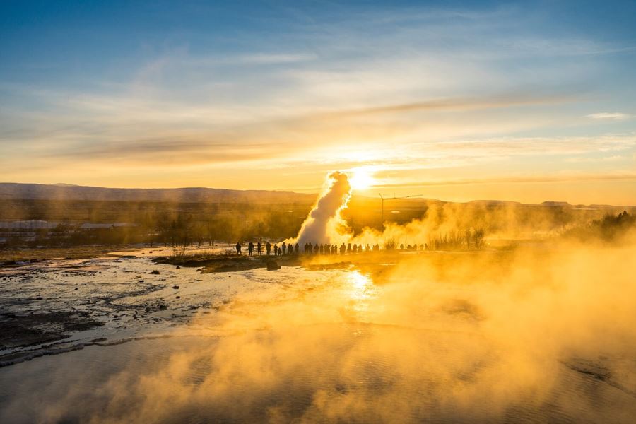 Geyser hot springs area at sunset in Iceland