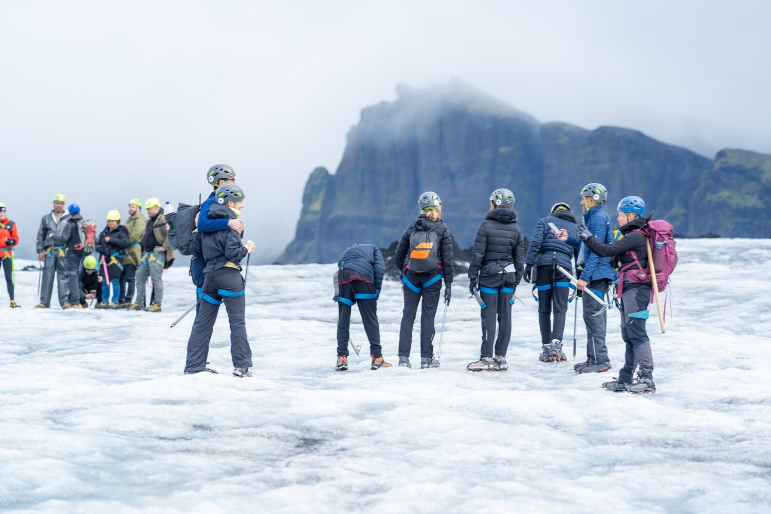 Group of people taking photos on glacier