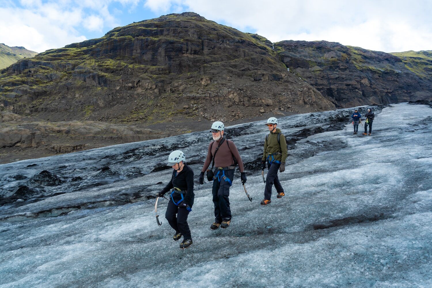 People walks down the glacier in Iceland