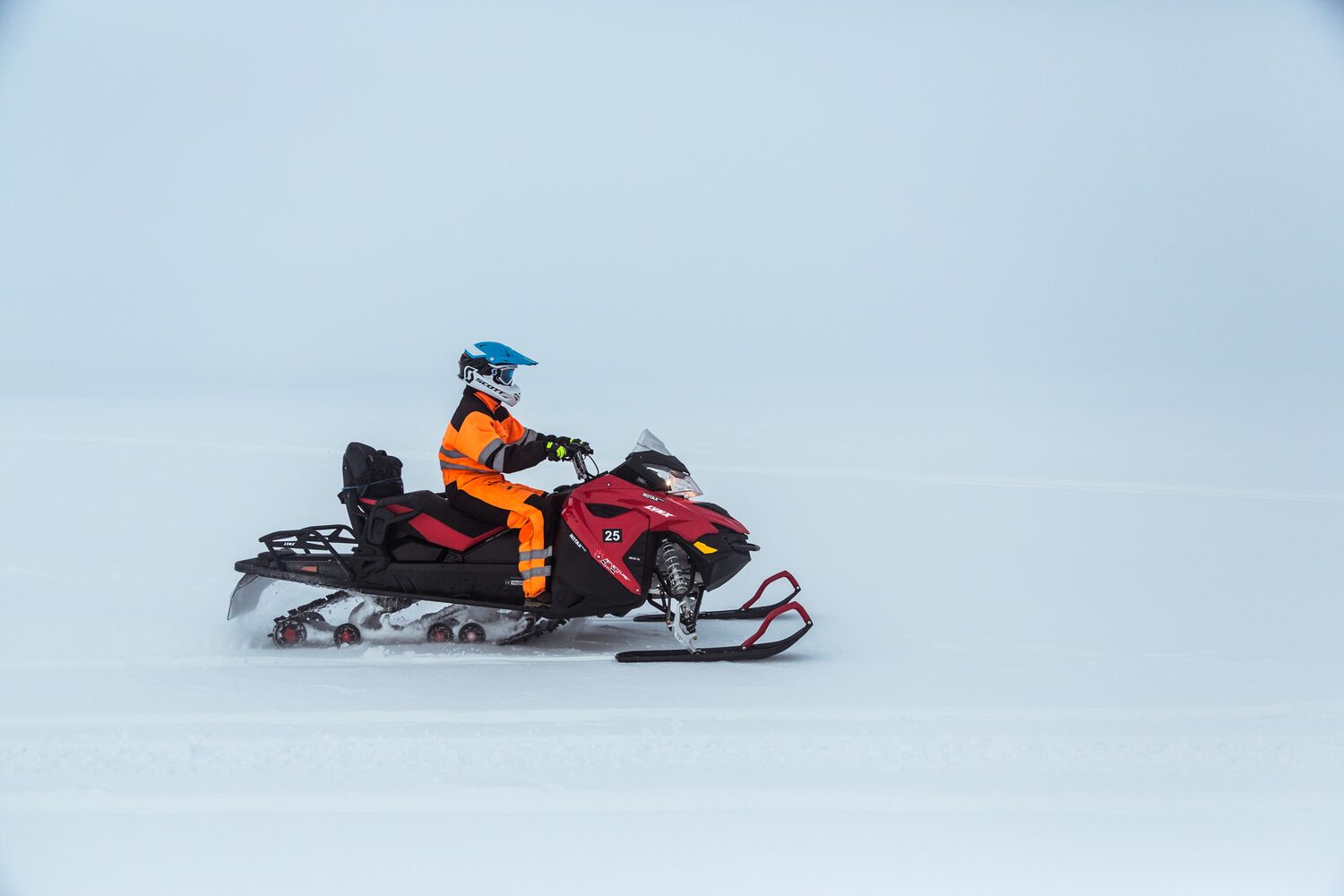 Man snowmobiling White Background