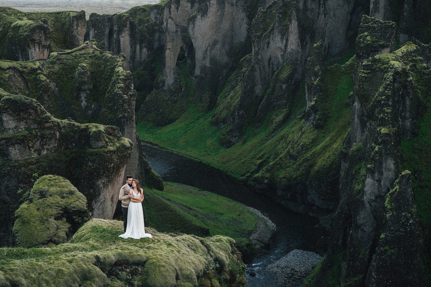 Couple having photoshoot in Icelandic canyon