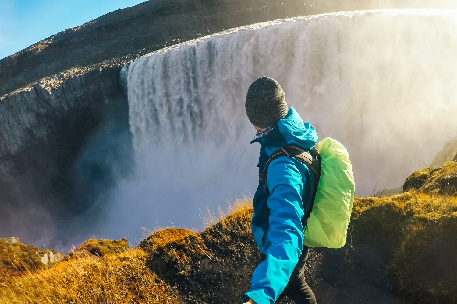 Man taking selfie by waterfall in Iceland
