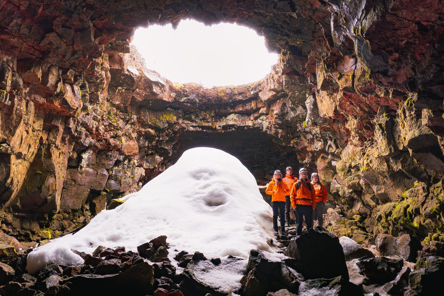 Lava Cave Snow Tourists
